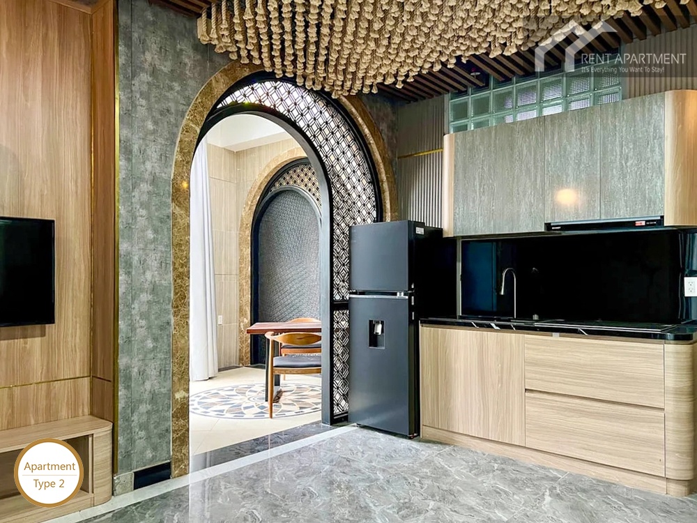 La Rosa 1-Bed kitchen area with refrigerator and arched opening to covered terrace