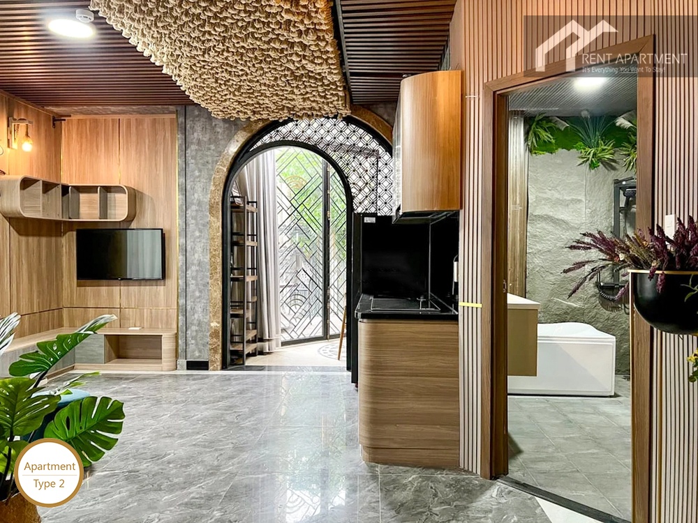La Rosa 1-Bed living area and kitchen counter overview with bathroom doorwayv
