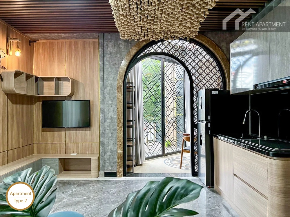 La Rosa 1-Bed open plan living room and kitchen counter with arched balcony access