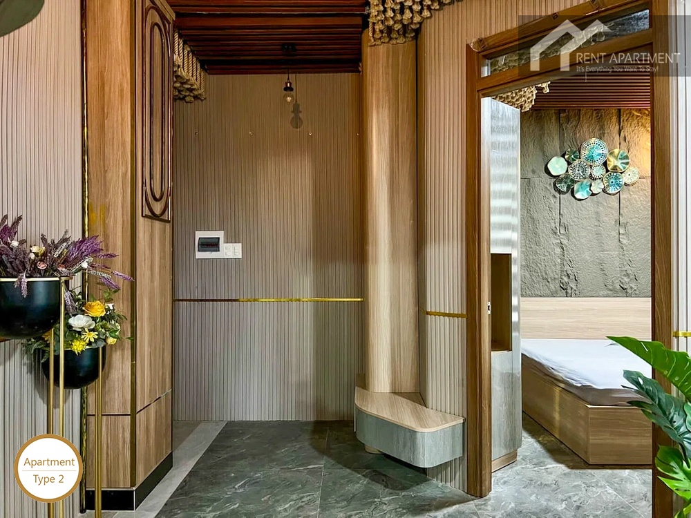 La Rosa 1-Bed stylish hallway with fluted wall panels looking into bedroom