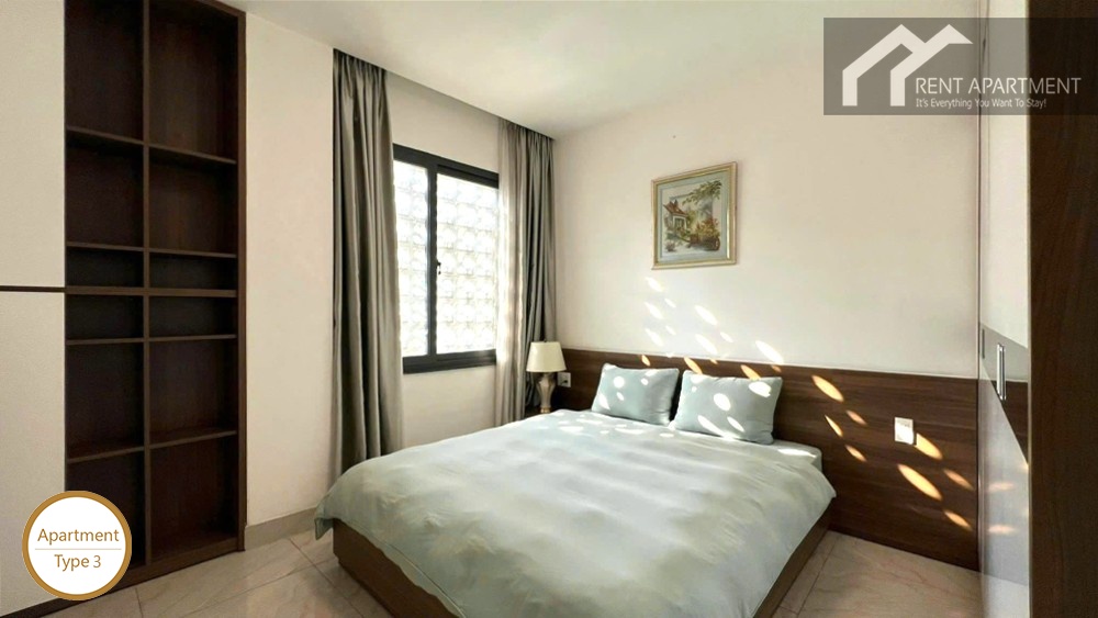 La Rosa 2-Bed cozy second bedroom with double bed bookshelf and natural window light