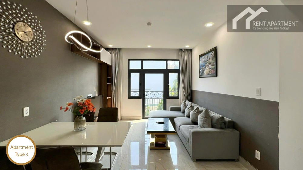 La Rosa 2-Bed open living room with dining table sofa and sunny balcony door