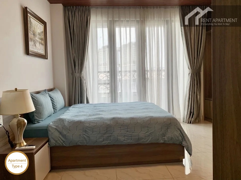 La Rosa 3-Bed master bedroom with double bed bedside table and balcony glass door