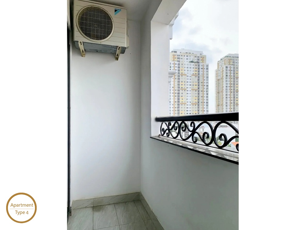 La Rosa 3-Bed private balcony with decorative iron railing and city highrise view
