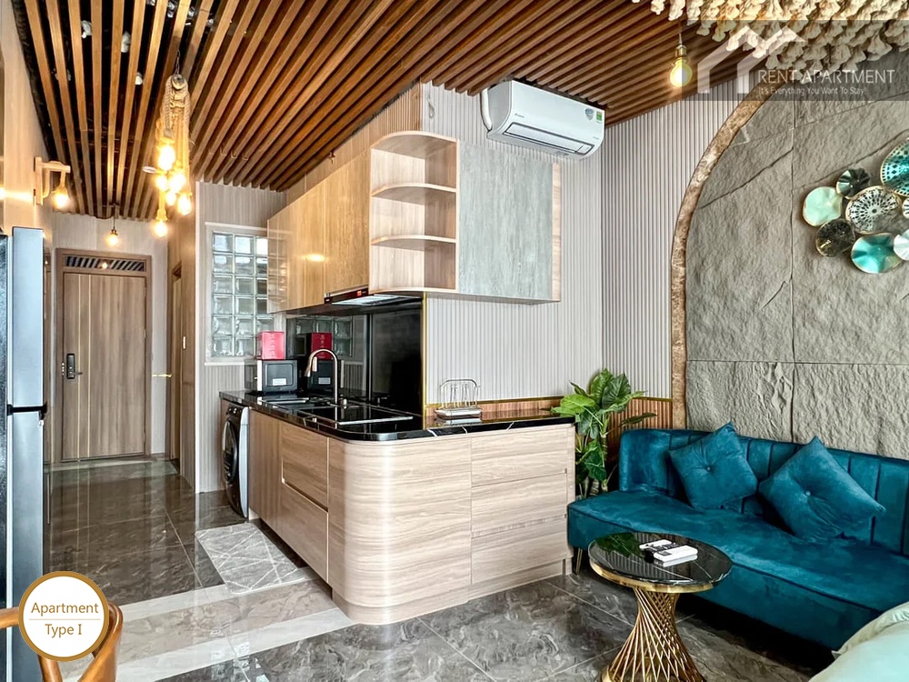 La Rosa Studio modern wooden kitchenette counter with washing machine and blue sofa