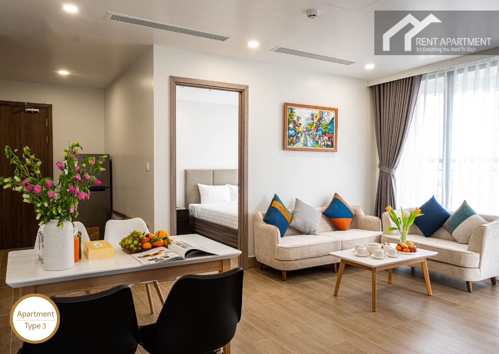 ID 2026 3-Bed living room with comfortable sofas dining table and bedroom entrance