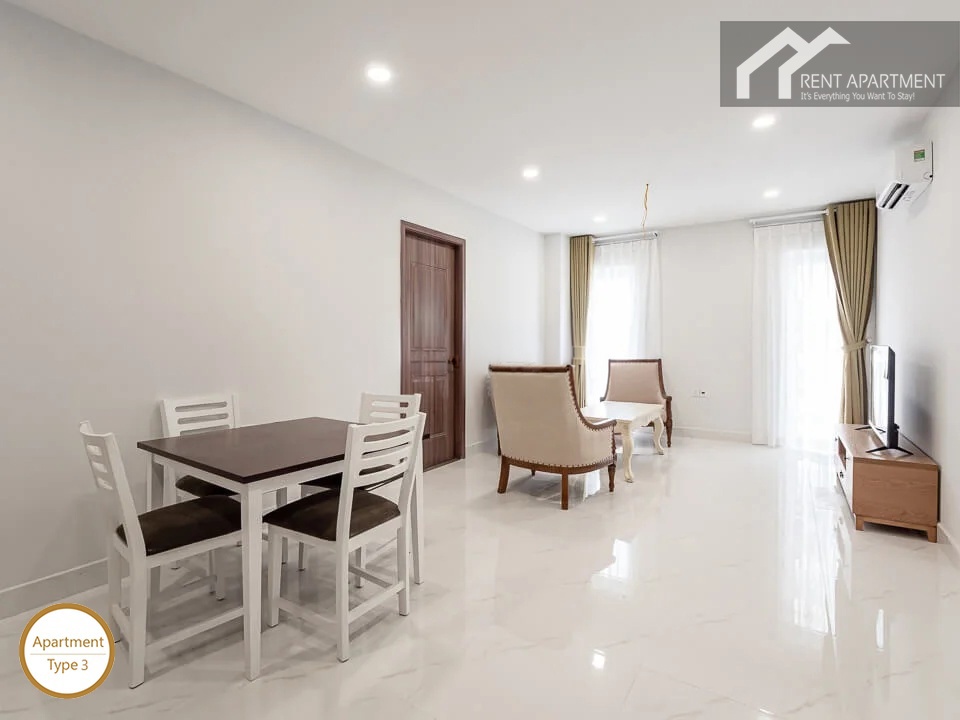 ID 2030 type 3 dining space with wooden table white chairs and open living room area