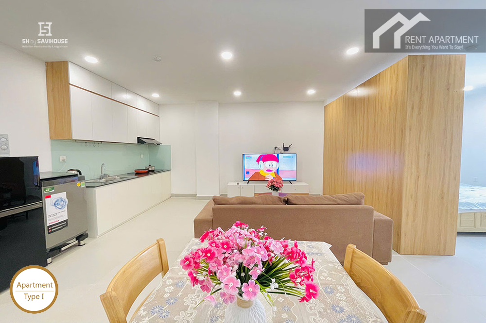 ID 2031 type 1 dining area with floral arrangement living room and open kitchen overview