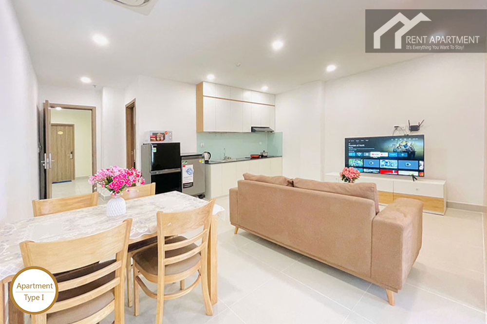 ID 2031 type 1 dining space with wooden chairs brown sofa and smart tv setup