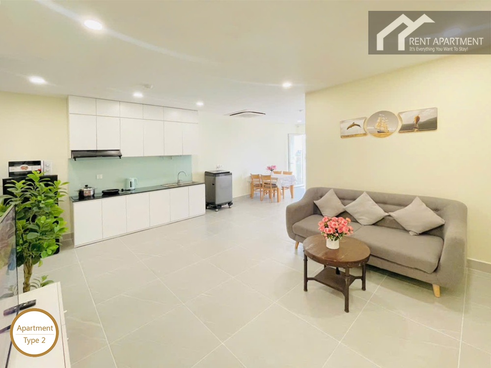 ID 2031 type 2 open concept living room with grey sofa white kitchen cabinets and washing machine