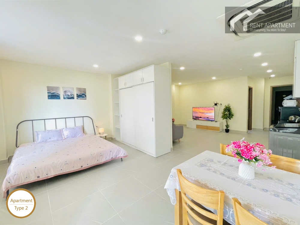 ID 2031 type 2 open plan studio layout with bed white wardrobe dining table and living area
