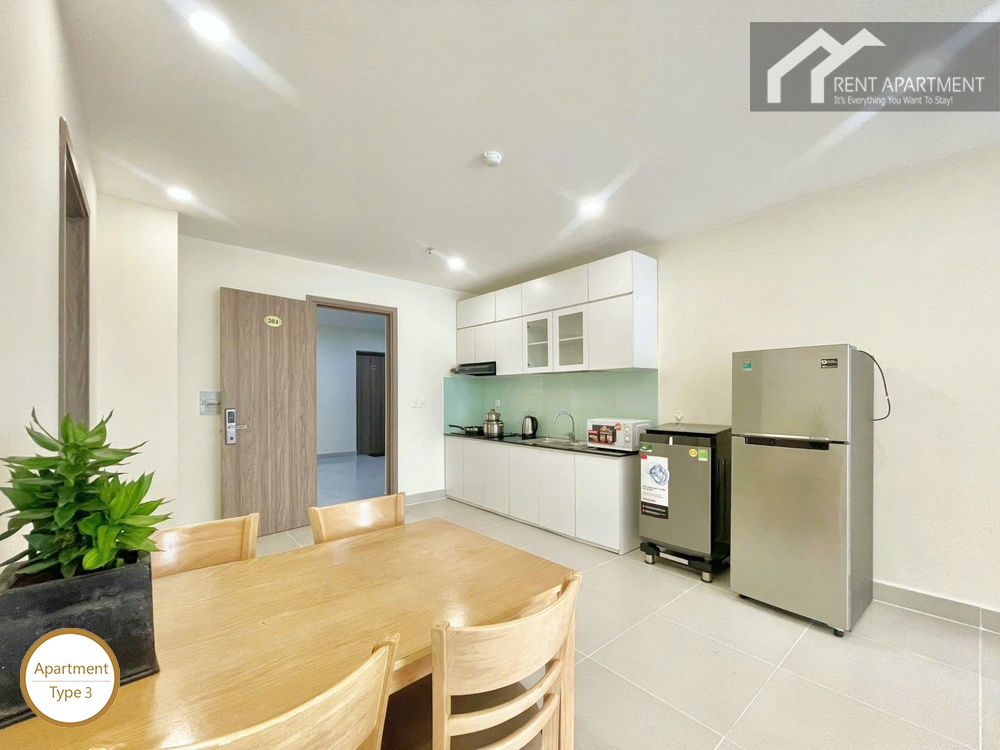 ID 2031 type 3 dining area with wooden table kitchen cabinets and entry door