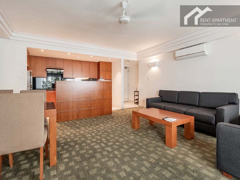 ID 2054 living room area with dark sofa looking towards kitchen breakfast bar