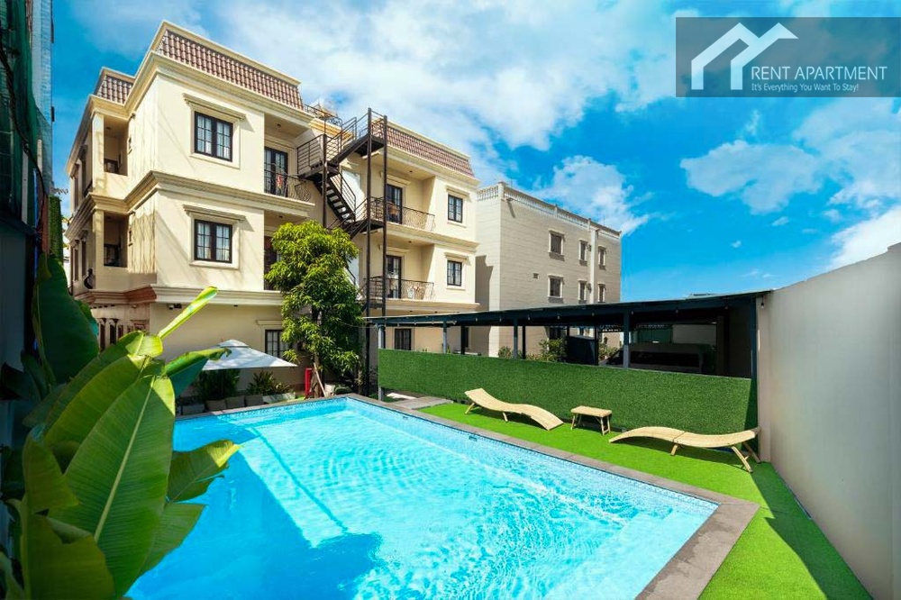 ID 2166 outdoor swimming pool with sun loungers and building view