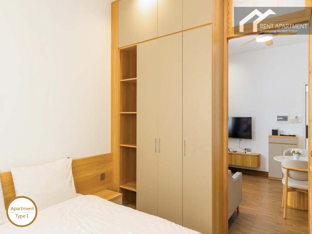 ID 2166 type 1 comfortable bedroom with wooden headboard wardrobe and view through to living room
