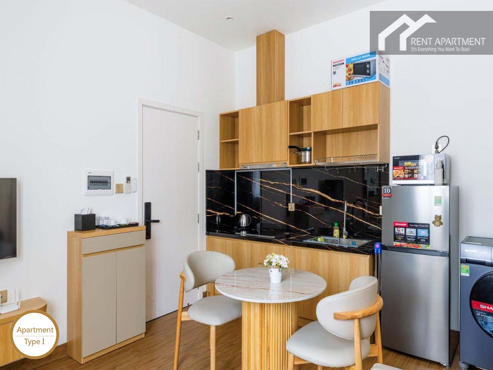 ID 2166 type 1 kitchenette with wooden cabinets black backsplash round dining table and refrigerator