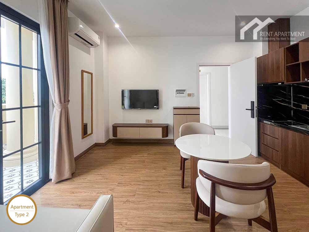 ID 2166 type 2 bright living room facing balcony door with dining table and wall tv
