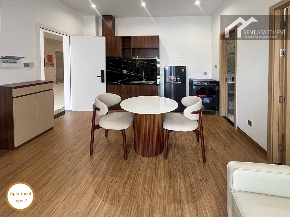 ID 2166 type 2 dining area with round marble table dark kitchen cabinets and shoe rack