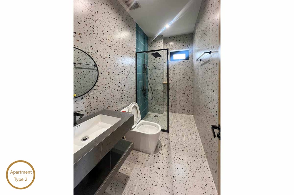 ID 2166 type 2 modern terrazzo bathroom with dark vanity and glass shower booth