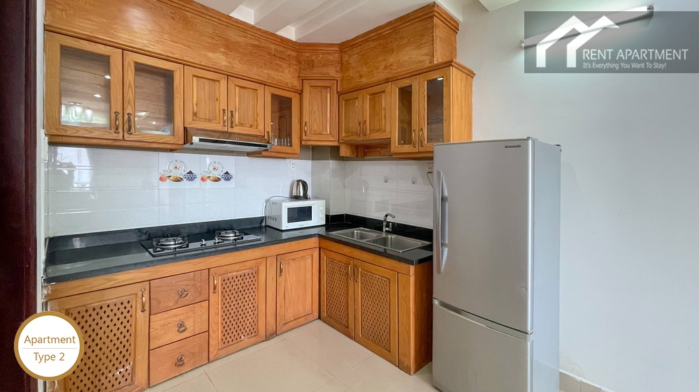 ID 2222 fully equipped kitchen with wooden cabinets and refrigerator