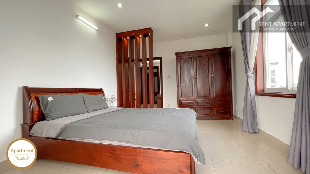 ID 2222 master bedroom with wooden bed and dark wood wardrobe