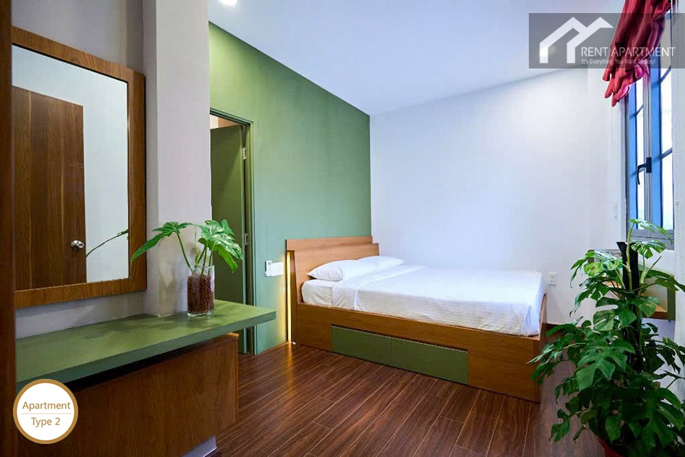 ID 2224 1br bedroom with wooden bed frame vanity mirror and window