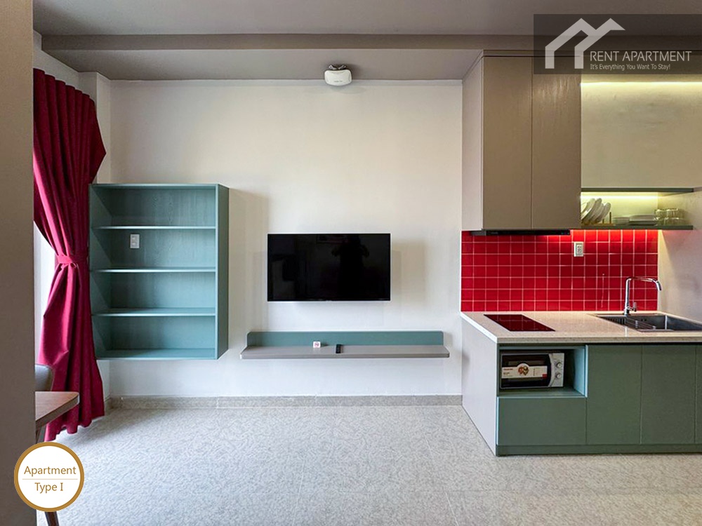 ID 2224 studio living area with tv wall bookshelf and red tile kitchen