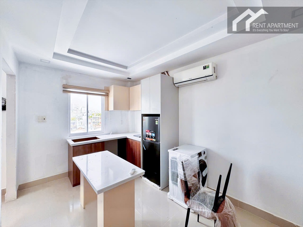ID 2230 kitchen area with island table black fridge and window