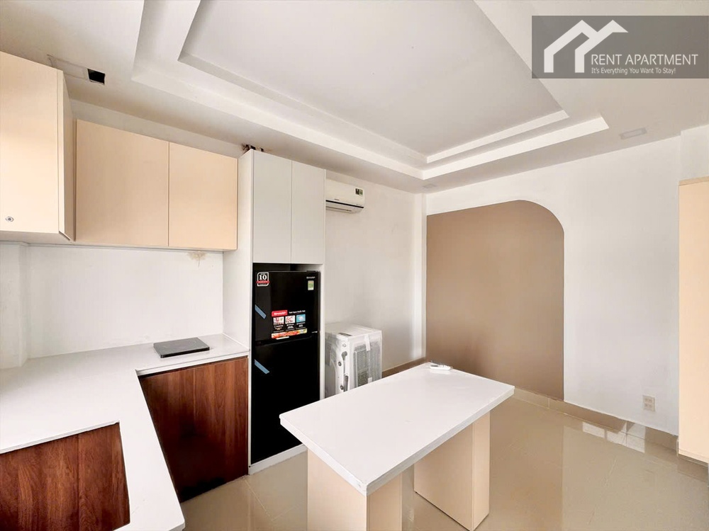 ID 2230 kitchen with white island table L shaped countertop and black fridge