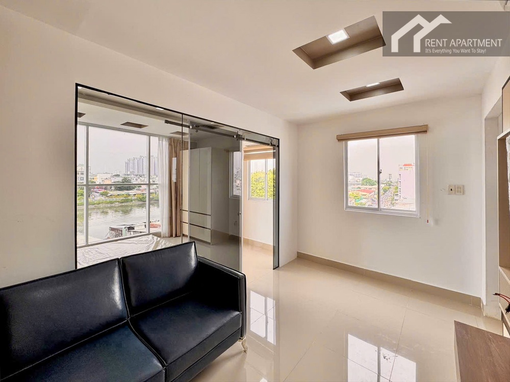 ID 2230 spacious living room with blue leather sofa and bright window view