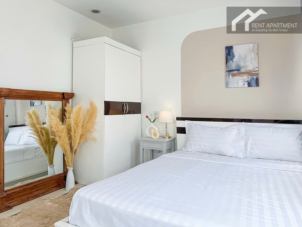 ID 2231 bedroom with white bed standing mirror and pampas grass