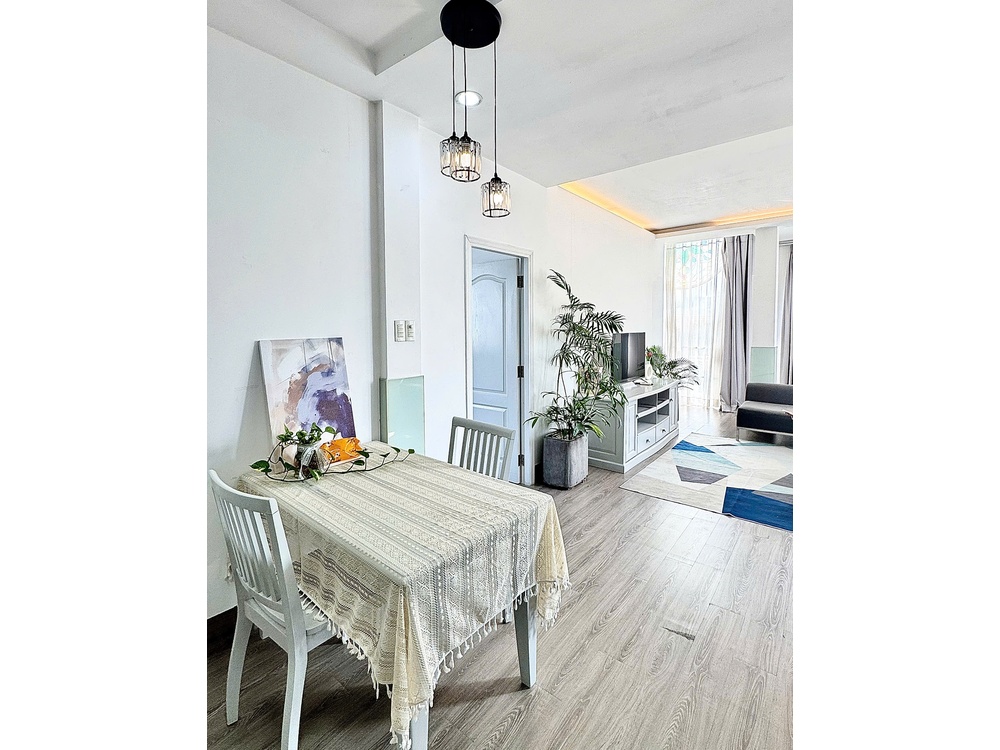 ID 2231 dining table with patterned tablecloth and pendant lights