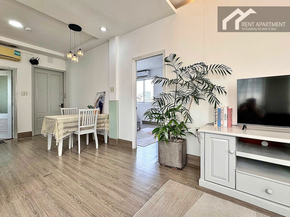 ID 2231 living dining space with wooden floor tv unit and plant
