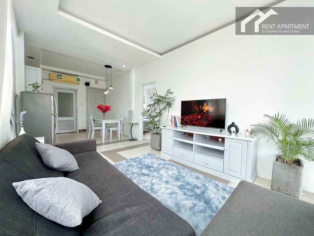 ID 2231 living room with dark sofa blue rug and tv cabinet