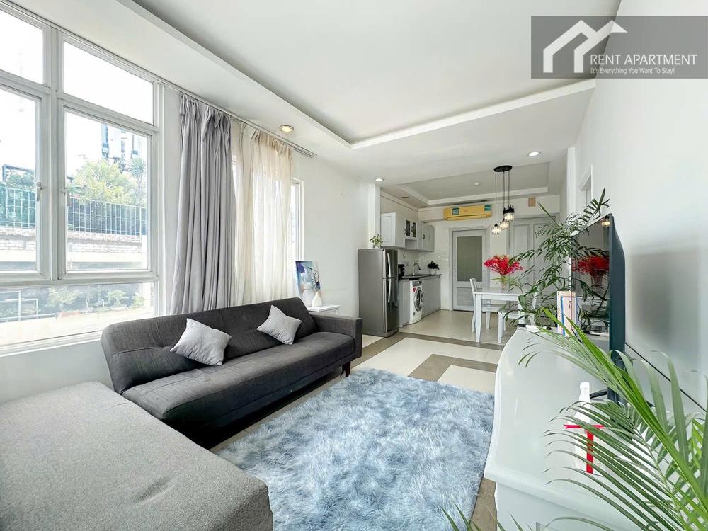 ID 2231 open living area with sofa blue rug and kitchen view