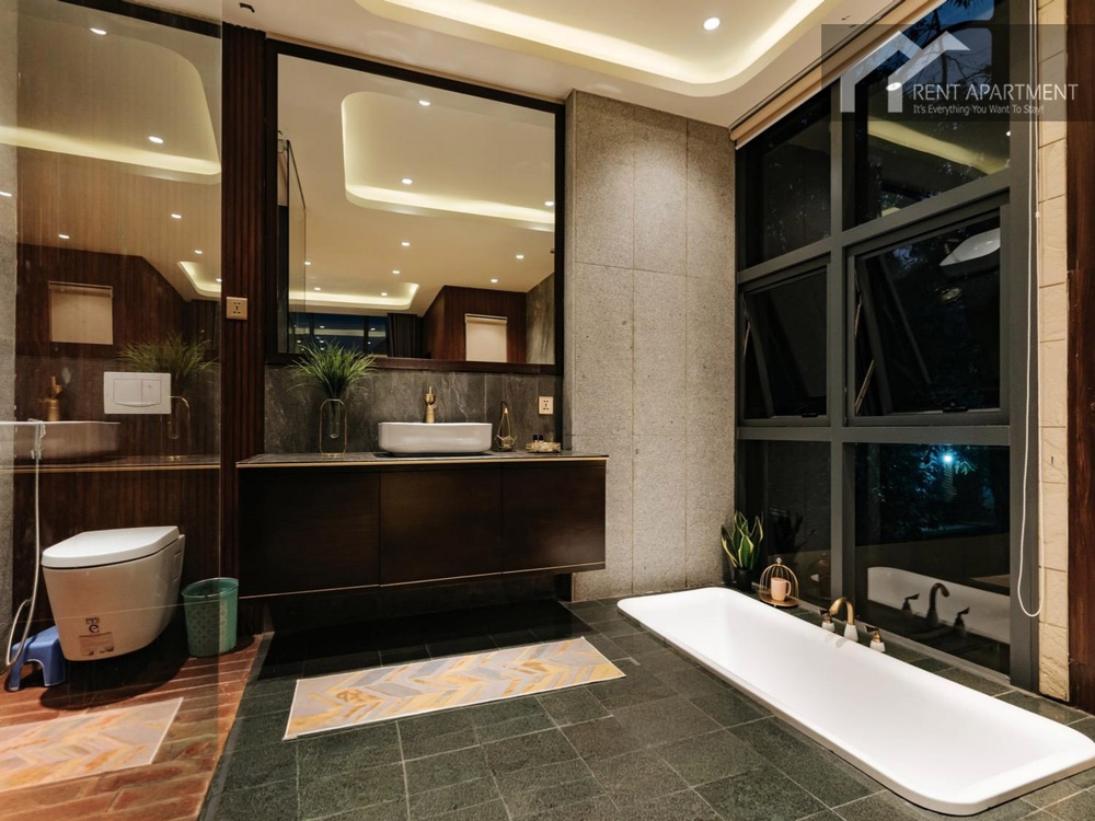 ID 2237 The open space bathroom has 2 layers floors finished with bronzy stone and installed Haffele's in-floor-bathtub