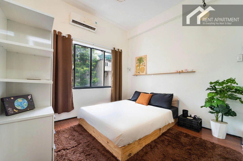 ID 2238 cozy bedroom with wooden double bed brown rug and plant