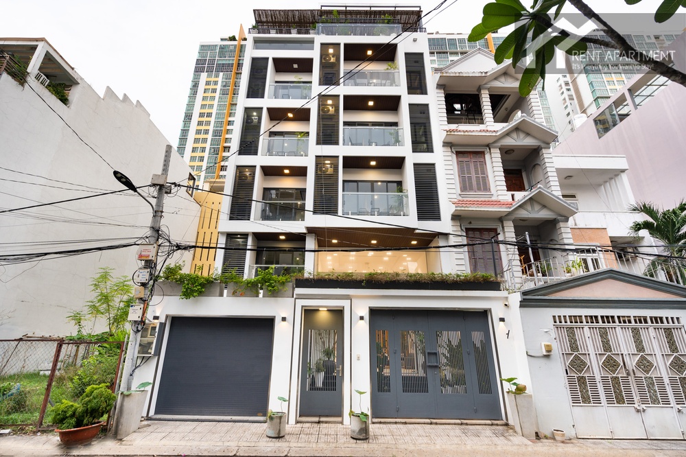 ID 2240 building exterior facade with balconies and garage gate