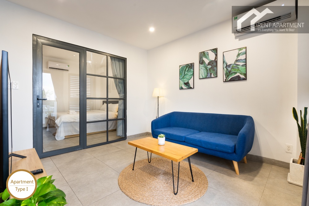 ID 2240 type 1 living room with blue couch and glass partition to bedroom