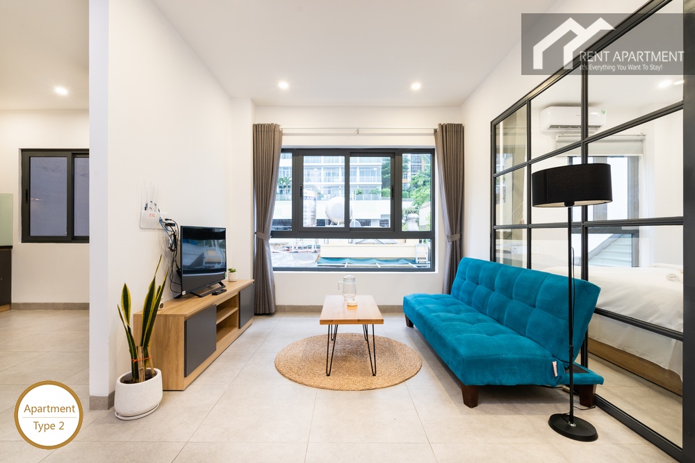 ID 2240 type 2 living room with blue futon sofa coffee table and window view
