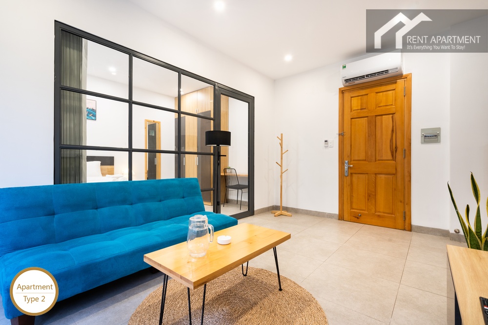 ID 2240 type 2 living room with blue sofa wooden main door and glass wall