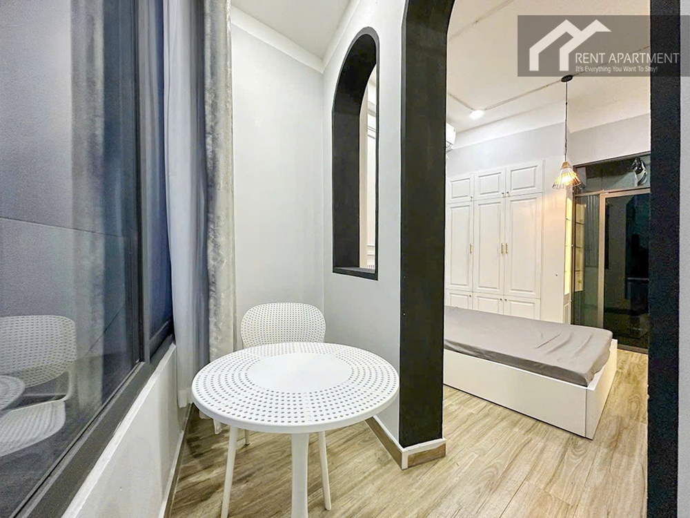 ID 2242 enclosed balcony nook with white coffee table and window view