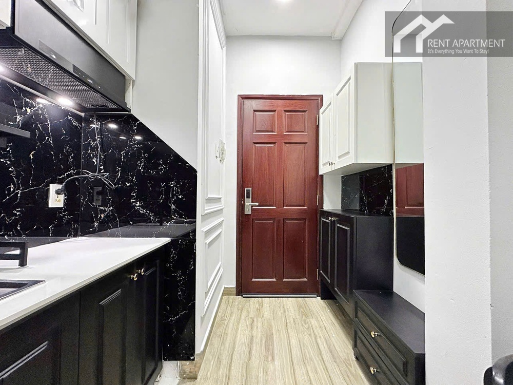 ID 2242 entrance hallway with wooden door and kitchen cabinets