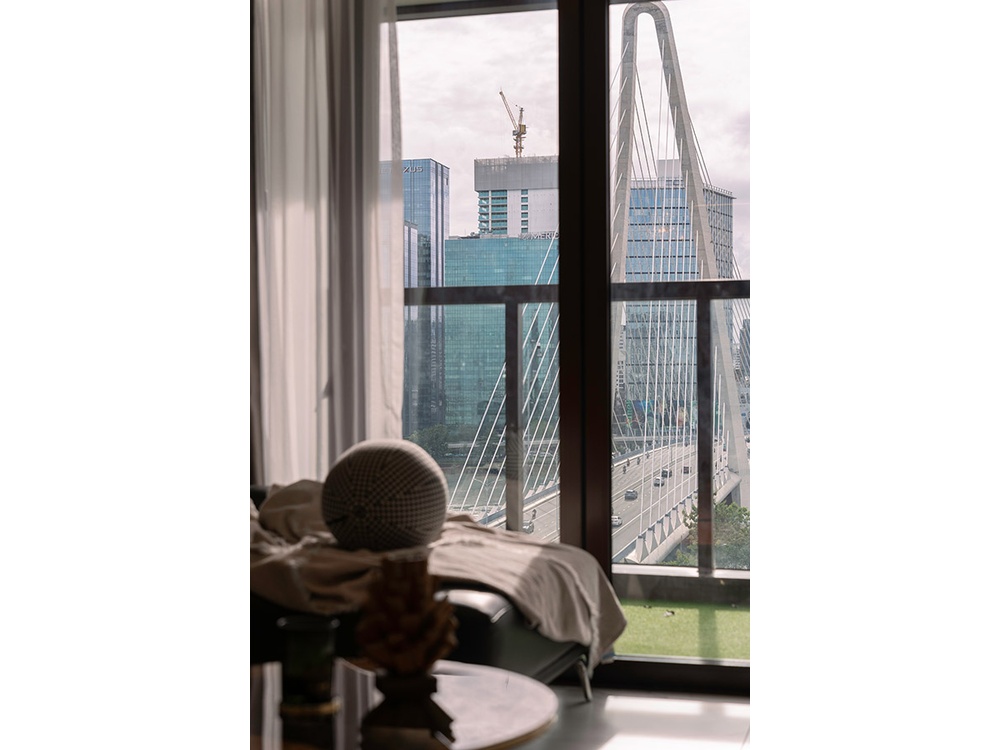 ID-2256-close-up-window-view-of-cable-stayed-bridge-and-surrounding-cityscape