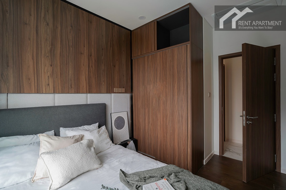 ID 2256 cozy second bedroom with walnut feature wall and built in wardrobe.