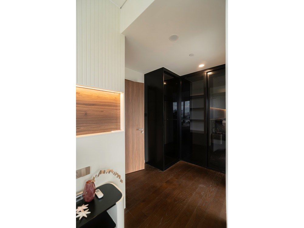 ID 2256 master bedroom walk in closet with sleek tinted glass wardrobe doors.