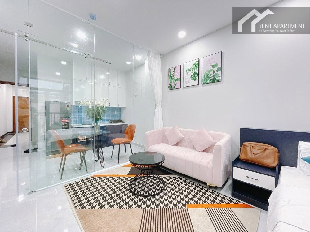 ID 2257 cozy living area with pink sofa beside glass enclosed kitchen