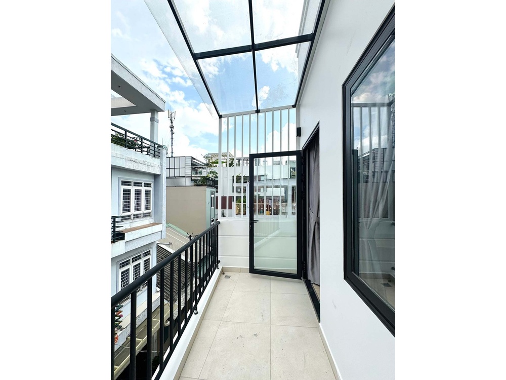 ID 2261 spacious outdoor balcony with glass canopy and neighborhood view
