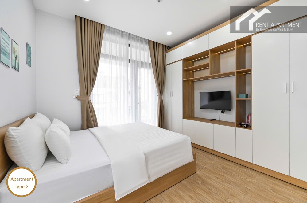ID 2223 type 2 comfortable double bed with white linens and wall tv unit