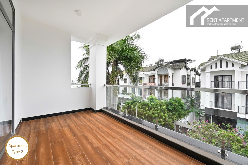ID 2223 type 2 spacious outdoor balcony with glass railing and palm tree view